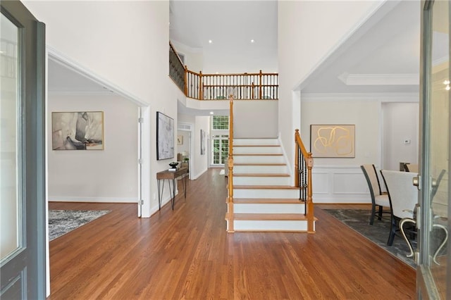 735 River Ridge Lane, Suwanee, GA 30024 - entrance foyer with wood finished floors, stairway, crown molding, and a towering ceiling