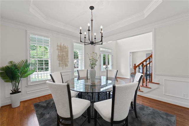 735 River Ridge Lane, Suwanee, GA 30024 - dining space featuring a chandelier, healthy amount of natural light, stairway, a tray ceiling, and crown molding