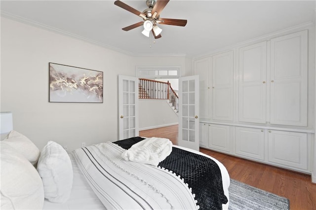 735 River Ridge Lane, Suwanee, GA 30024 - bedroom featuring french doors, wood finished floors, ornamental molding, and ceiling fan