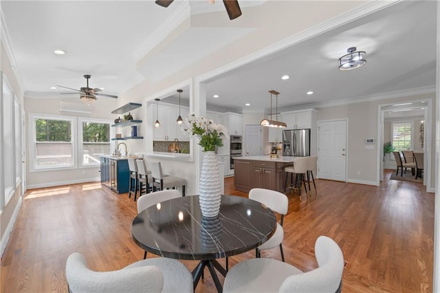 735 River Ridge Lane, Suwanee, GA 30024 - living area with ceiling fan, ornamental molding, baseboards, wood finished floors, and recessed lighting