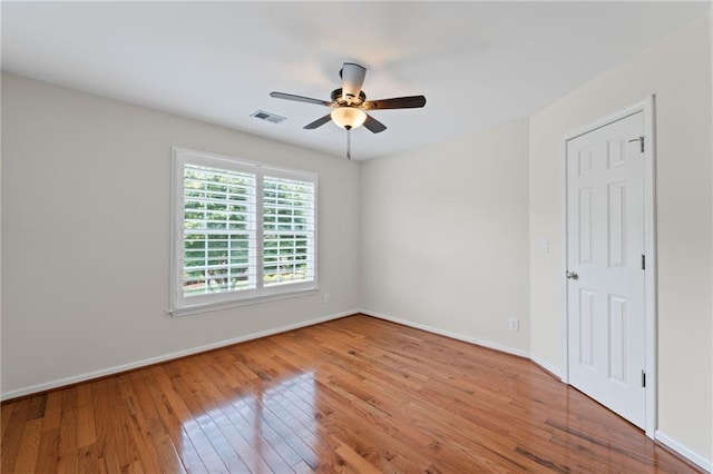 735 River Ridge Lane, Suwanee, GA 30024 - unfurnished bedroom with wood finished floors, baseboards, and ceiling fan