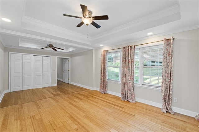 735 River Ridge Lane, Suwanee, GA 30024 - unfurnished bedroom with a raised ceiling, light wood finished floors, ornamental molding, baseboards, and recessed lighting