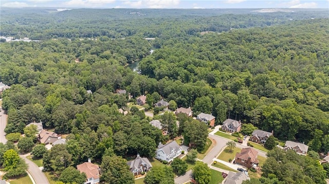 735 River Ridge Lane, Suwanee, GA 30024 - aerial overview of property's location with a heavily wooded area and nearby suburban area