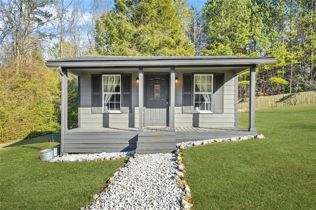 view of front of property with a porch and a front yard