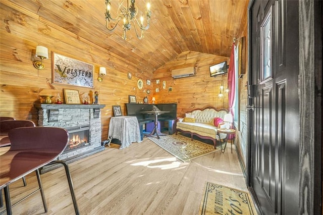 unfurnished room featuring lofted ceiling, hardwood / wood-style floors, a notable chandelier, a stone fireplace, and wooden ceiling