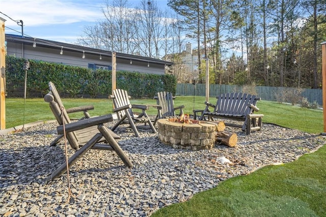 view of yard with an outdoor fire pit