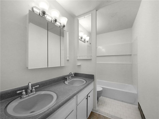 full bathroom featuring tile patterned floors, shower / washtub combination, vanity, and toilet