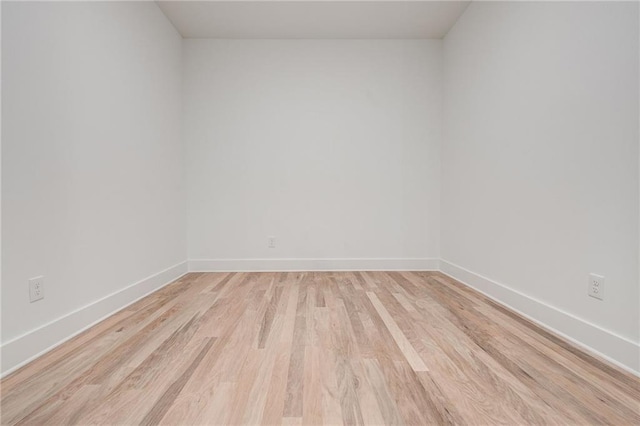 unfurnished room with light hardwood / wood-style flooring