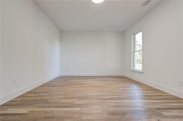 unfurnished room featuring light wood-type flooring