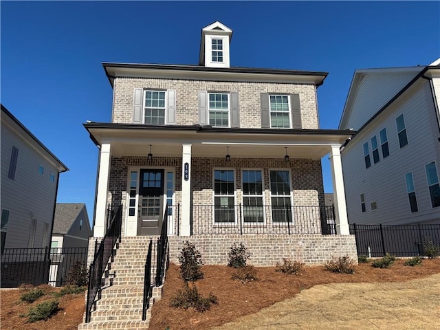 175 Basil St, Cumming, GA 30040 - view of front of house featuring a porch, brick siding, and stairway
