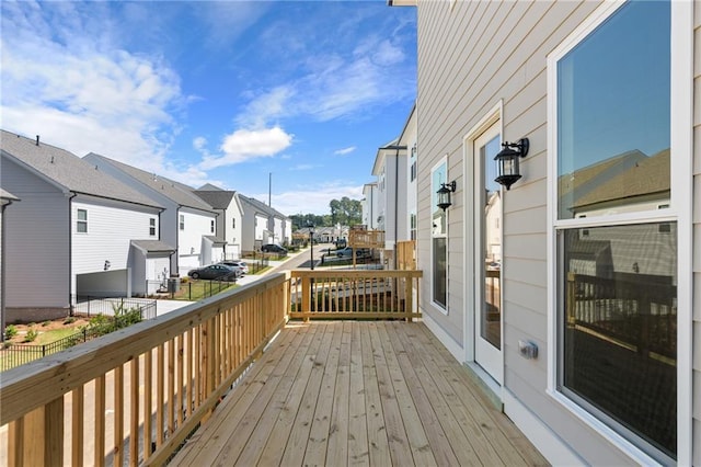 wooden terrace with a residential view