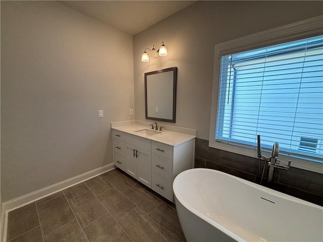 175 Basil St, Cumming, GA 30040 - bathroom with a freestanding bath and vanity