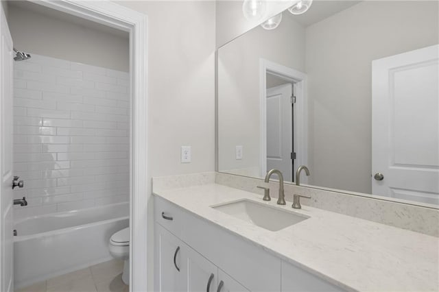 full bath with toilet,  shower combination, vanity, and tile patterned flooring