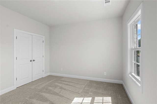 175 Basil St, Cumming, GA 30040 - unfurnished bedroom featuring carpet and a closet