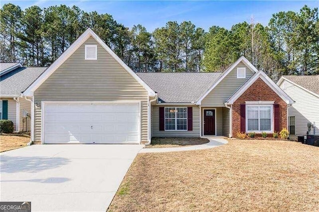 2350 Laurel Pointe Ln, Lawrenceville, GA 30043 - single story home featuring an attached garage, concrete driveway, and a front lawn