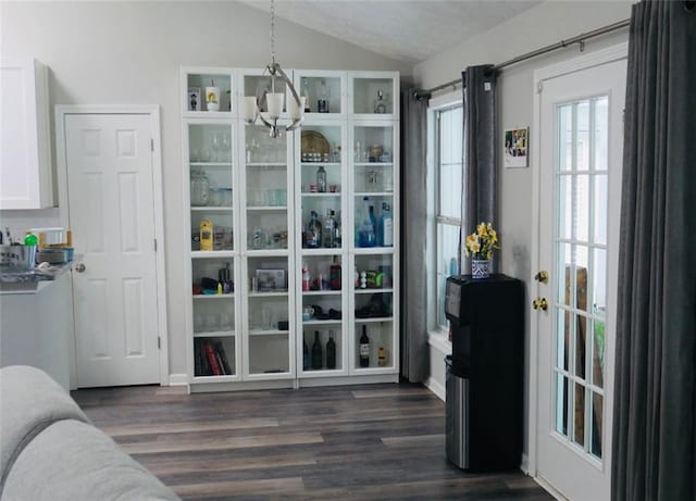 2350 Laurel Pointe Ln, Lawrenceville, GA 30043 - dining space with vaulted ceiling and dark wood-style flooring