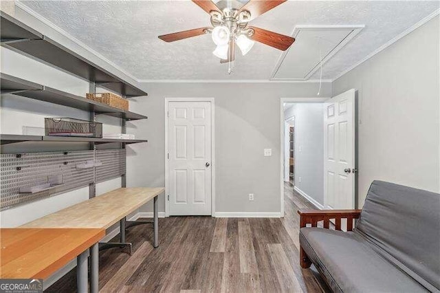 2350 Laurel Pointe Ln, Lawrenceville, GA 30043 - office area with attic access, wood finished floors, a ceiling fan, a textured ceiling, and crown molding
