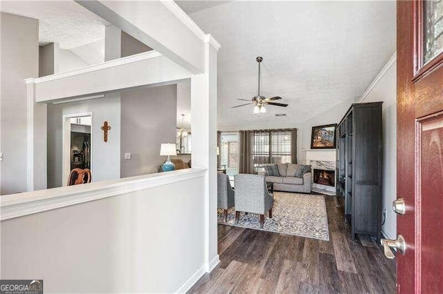 2350 Laurel Pointe Ln, Lawrenceville, GA 30043 - foyer featuring a ceiling fan, dark wood-type flooring, a fireplace, and lofted ceiling