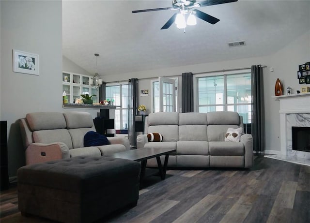 2350 Laurel Pointe Ln, Lawrenceville, GA 30043 - living area with vaulted ceiling, a ceiling fan, dark wood-style floors, a premium fireplace, and a chandelier