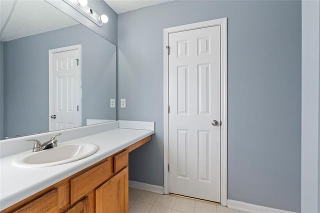 bathroom with vanity and tile patterned flooring