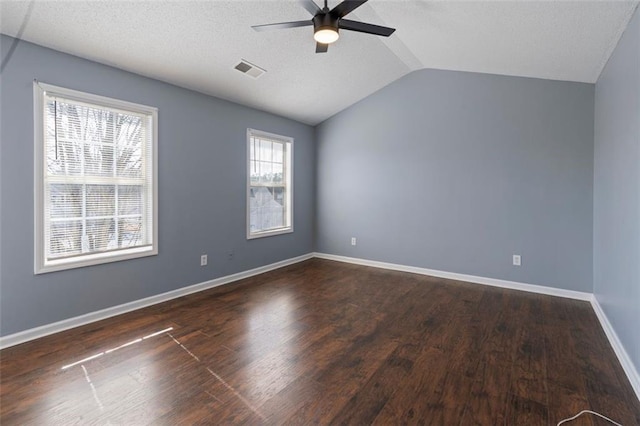 unfurnished room featuring ceiling fan, dark hardwood / wood-style flooring, and vaulted ceiling