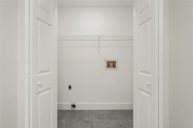 laundry area featuring washer hookup, laundry area, tile patterned flooring, baseboards, and electric dryer hookup