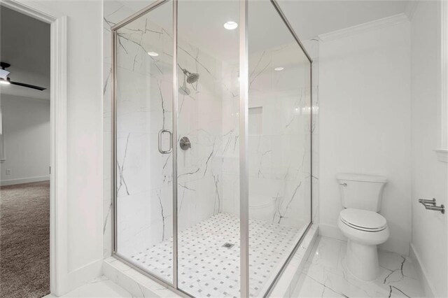 bathroom with baseboards, toilet, marble finish floor, a marble finish shower, and ornamental molding