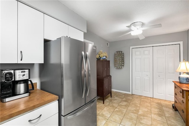 2349 Northlake Ct NE, Atlanta, GA 30345 - kitchen with freestanding refrigerator, white cabinets, a ceiling fan, and baseboards