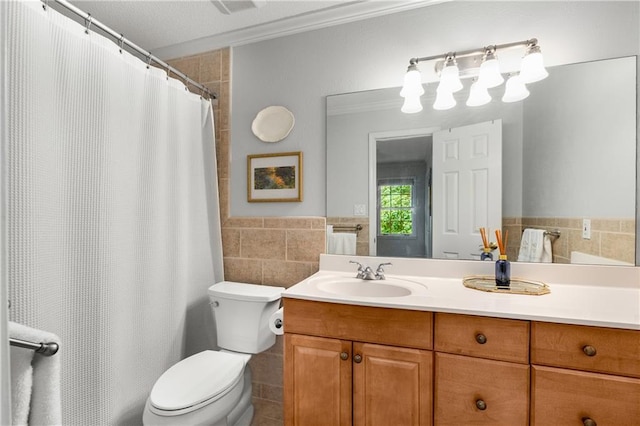 2349 Northlake Ct NE, Atlanta, GA 30345 - full bath featuring tile walls, vanity, toilet, a wainscoted wall, and ornamental molding