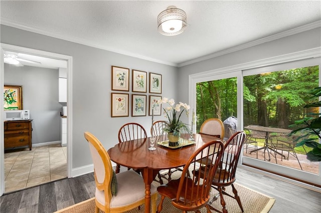 2349 Northlake Ct NE, Atlanta, GA 30345 - dining room featuring wood finished floors, ornamental molding, and baseboards