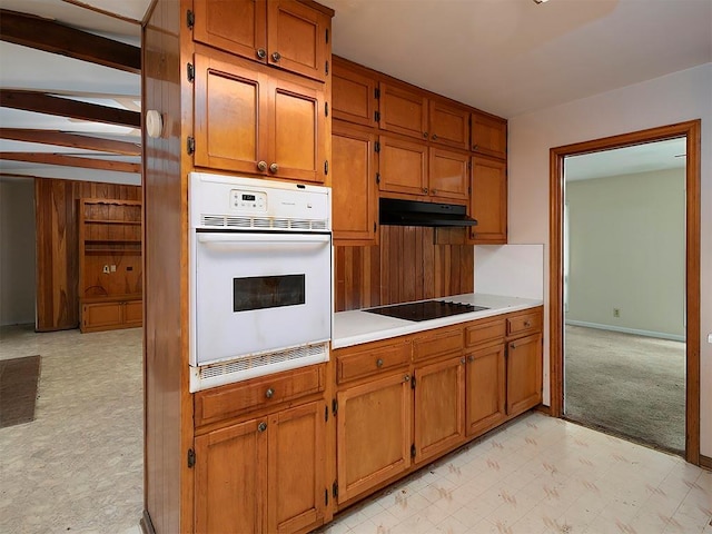 4135 Sunrise Trl, Atlanta, GA 30349 - unfurnished living room featuring carpet, a brick fireplace, and wooden walls