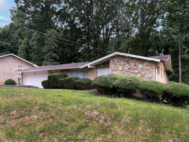 4135 Sunrise Trl, Atlanta, GA 30349 - view of grassy yard featuring an outbuilding and an attached garage
