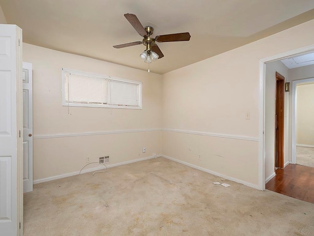 4135 Sunrise Trl, Atlanta, GA 30349 - unfurnished living room featuring wood walls, beam ceiling, a ceiling fan, a fireplace, and baseboards