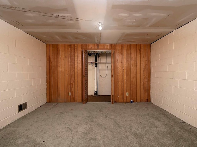 4135 Sunrise Trl, Atlanta, GA 30349 - finished below grade area featuring carpet flooring, concrete block wall, and wooden walls