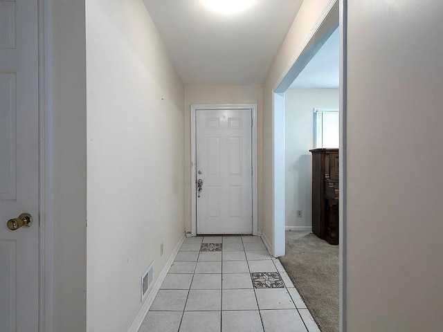 4135 Sunrise Trl, Atlanta, GA 30349 - doorway to outside featuring baseboards and light tile patterned floors