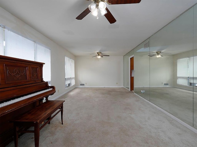 4135 Sunrise Trl, Atlanta, GA 30349 - unfurnished bedroom featuring a walk in closet, baseboards, unfinished concrete floors, a closet, and ceiling fan