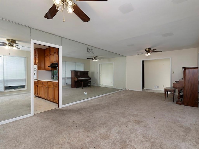 4135 Sunrise Trl, Atlanta, GA 30349 - unfurnished living room with light carpet and a ceiling fan