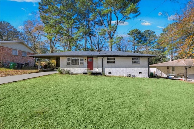 view of front of house with a front lawn and a carport