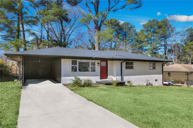 ranch-style home with a front yard and a carport