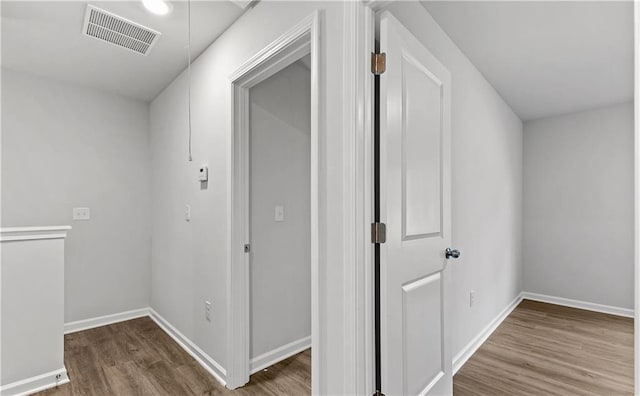 corridor featuring hardwood / wood-style flooring