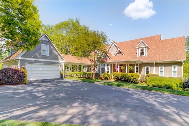 1126 Shoreline Dr, Jefferson, GA 30549 - cape cod house with asphalt driveway and a garage