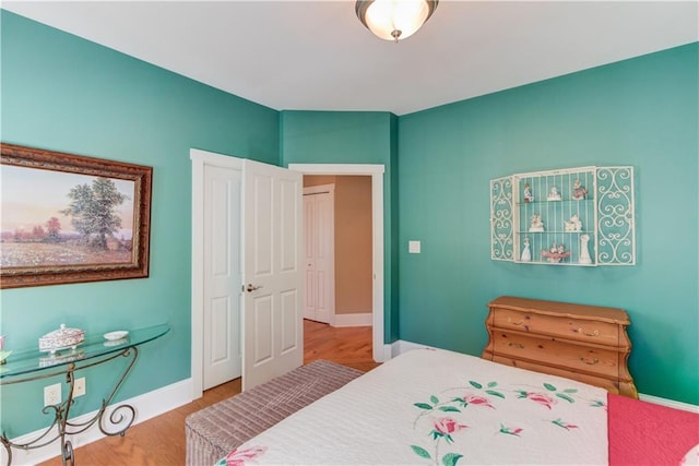 1126 Shoreline Dr, Jefferson, GA 30549 - bedroom with baseboards and wood finished floors