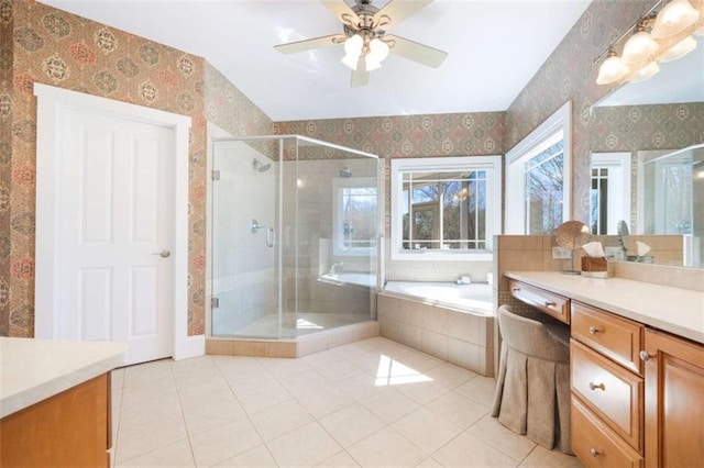 full bathroom featuring tile patterned flooring, a shower stall, wallpapered walls, a garden tub, and vanity