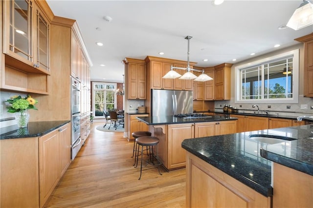 1126 Shoreline Dr, Jefferson, GA 30549 - kitchen with appliances with stainless steel finishes, a center island, light wood-style floors, recessed lighting, and backsplash