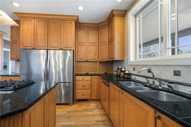 1126 Shoreline Dr, Jefferson, GA 30549 - kitchen with freestanding refrigerator, a sink, black gas stovetop, brown cabinetry, and light wood-style flooring