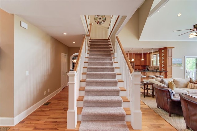 1126 Shoreline Dr, Jefferson, GA 30549 - stairway with wood finished floors, a ceiling fan, recessed lighting, and baseboards