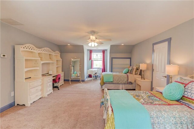 bedroom with light carpet, ceiling fan, baseboards, and visible vents