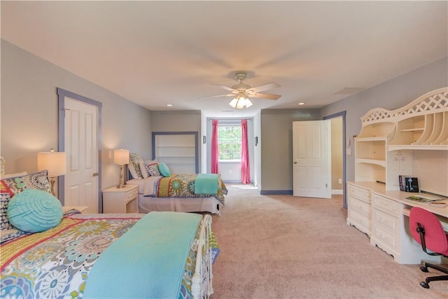bedroom featuring light carpet, ceiling fan, and baseboards