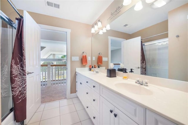 full bath with a shower with shower curtain, visible vents, and a sink