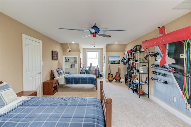 carpeted bedroom featuring baseboards and a ceiling fan